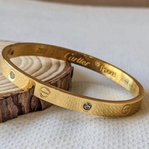 Gold cut with white stones hand cuff